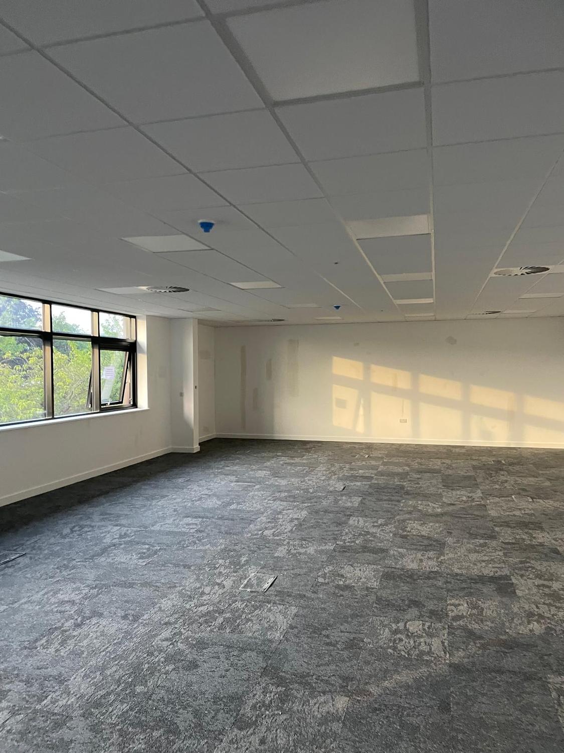 Completed open-plan office with suspended ceiling and finished walls by R.L. Freeman Ltd