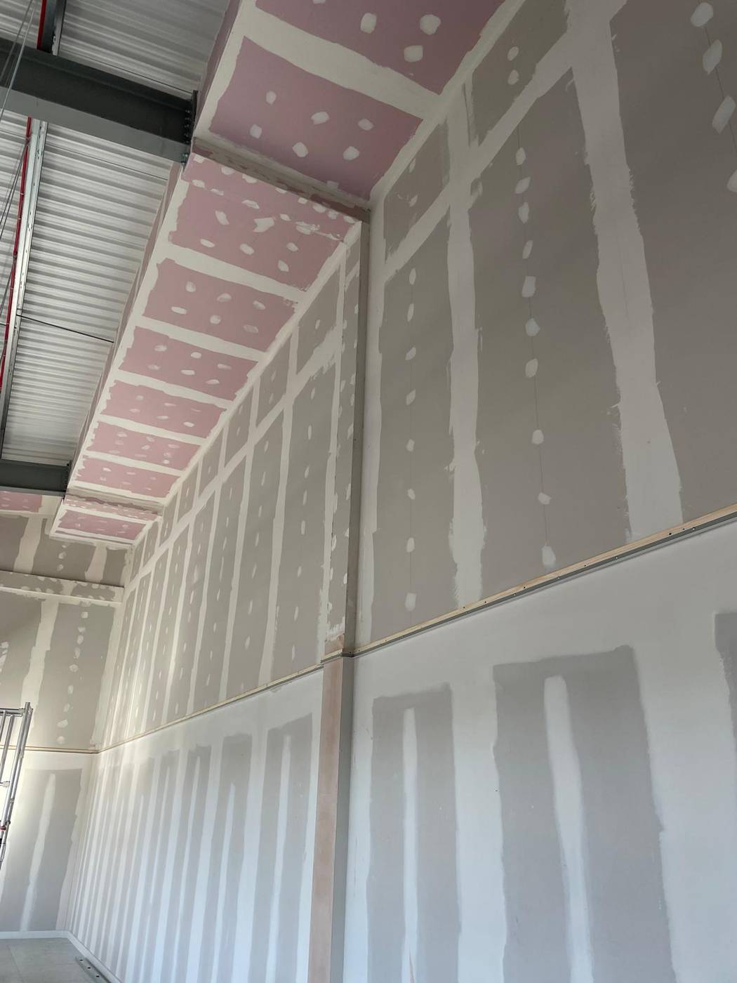 Drylined walls and ceiling with taped and jointed plasterboard