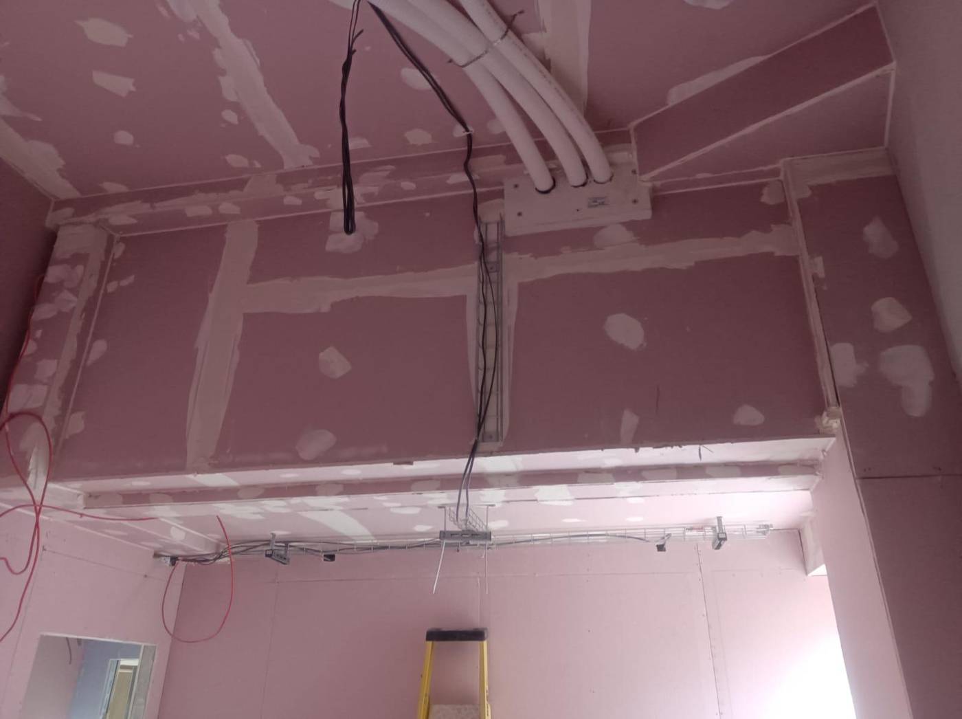 Boxed bulkhead and MF ceiling drylining around building services