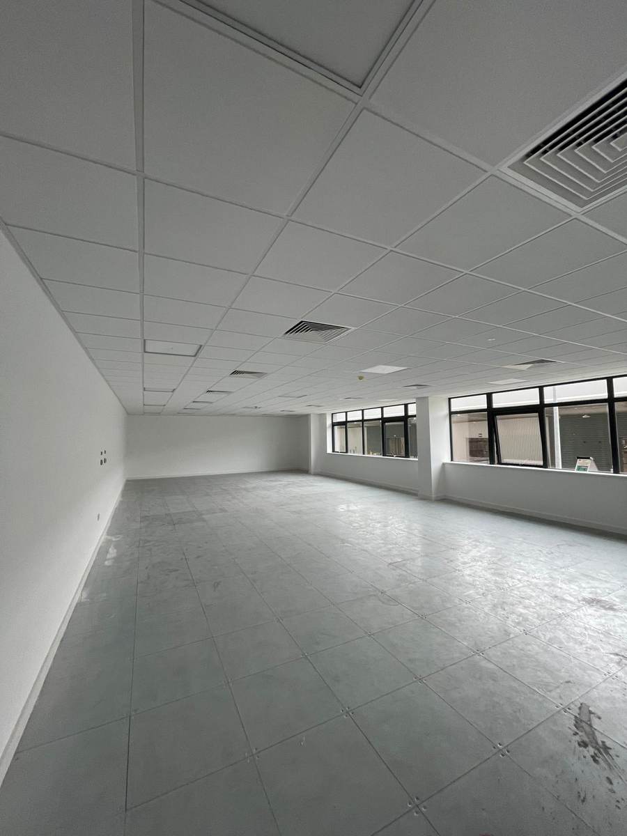 Completed office floor with suspended grid ceiling and raised access flooring