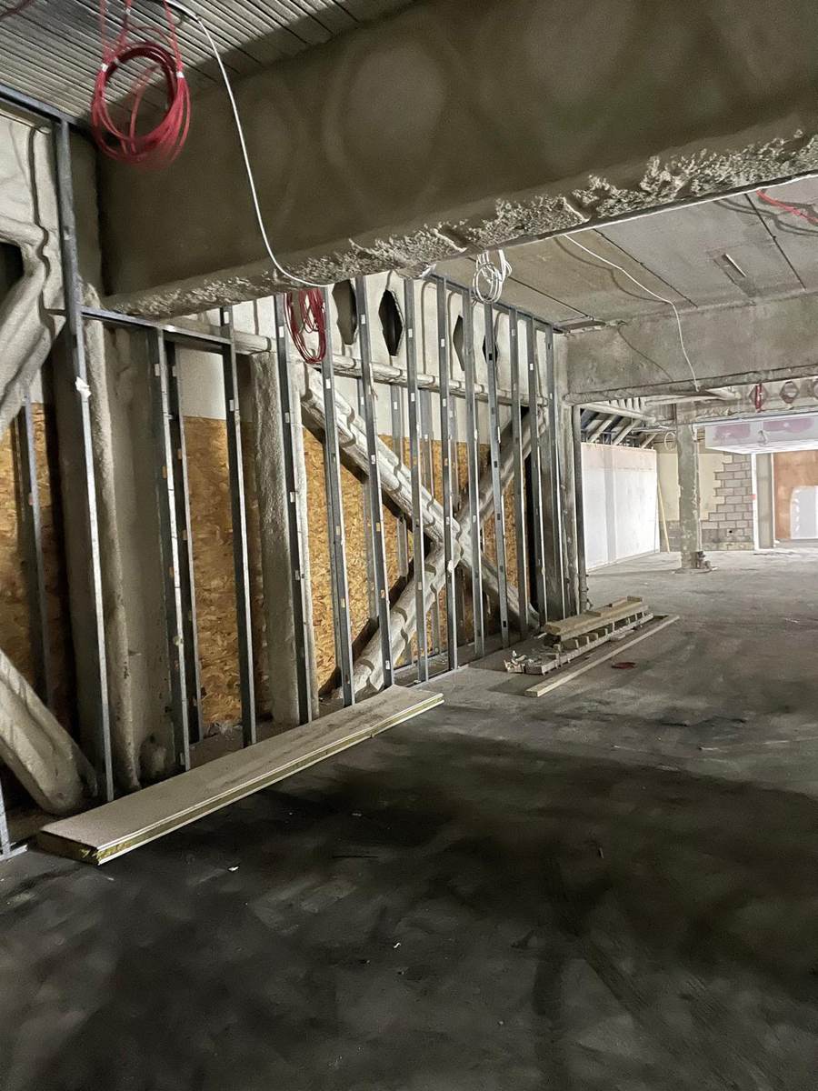 Metal stud partitions framed out against a concrete soffit on a fit-out