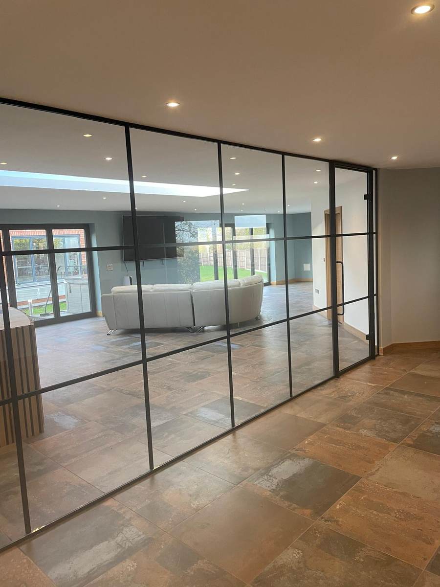 Finished interior with Crittall-style glazed partition and plastered ceiling