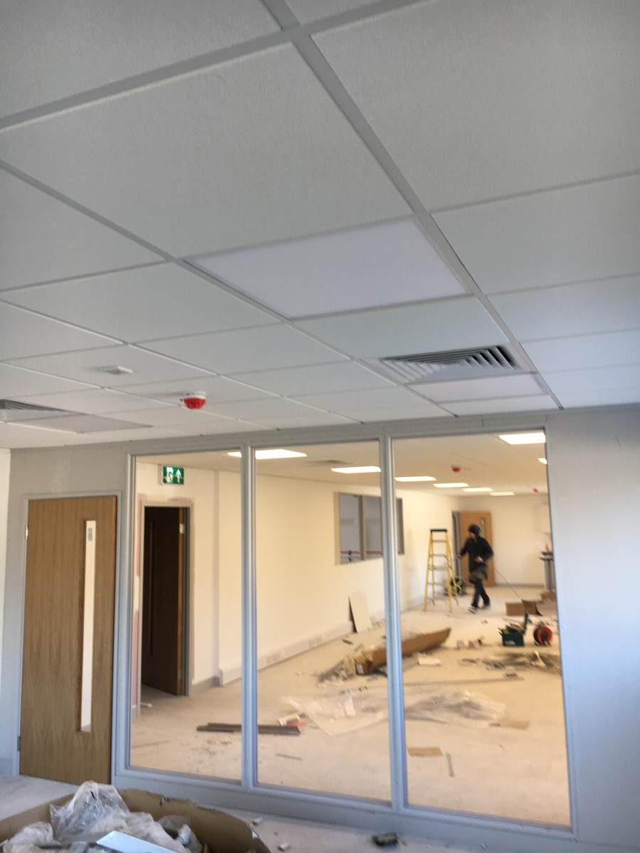 Office with suspended ceiling and glazed partition