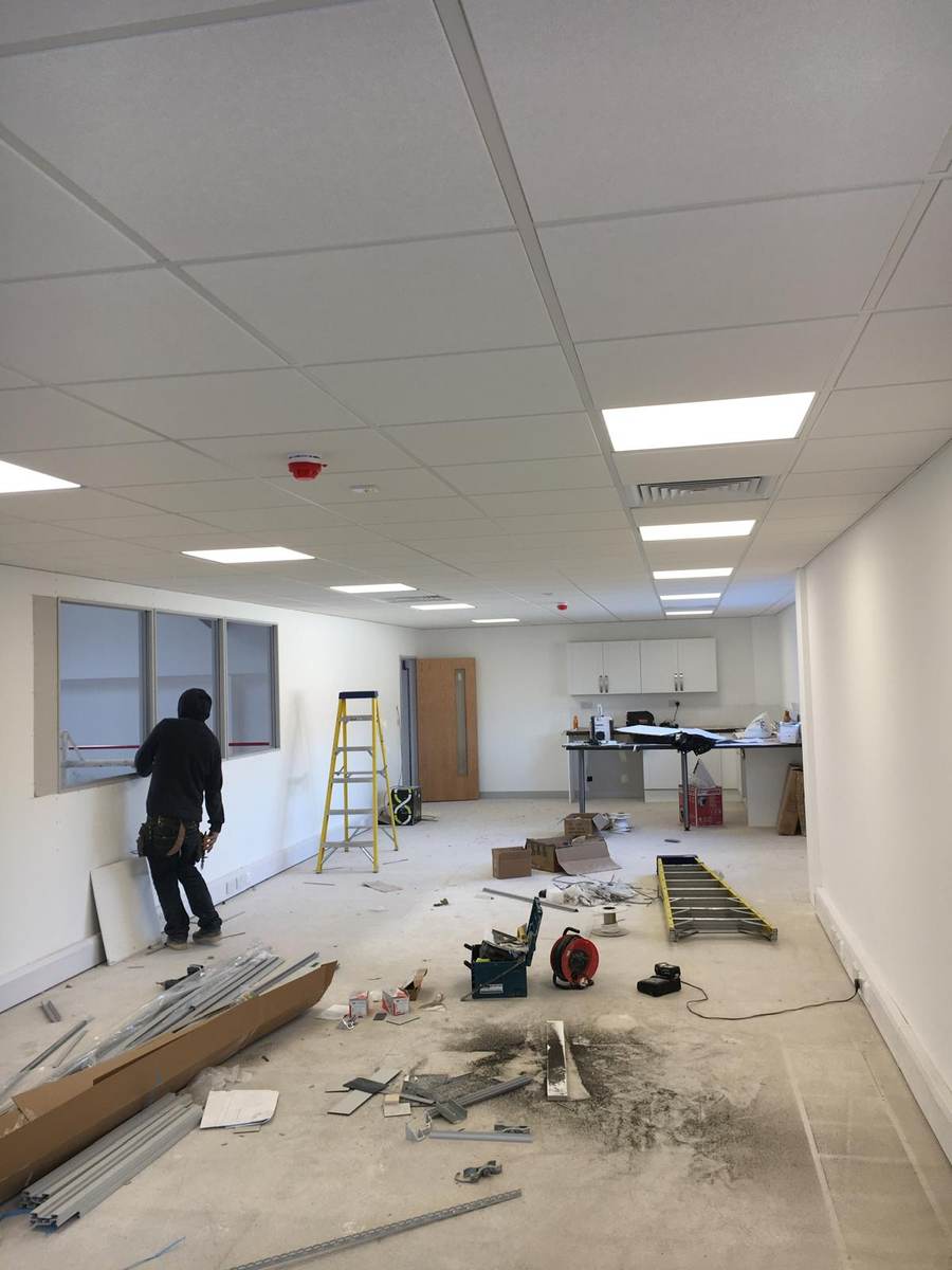 Office fit-out with suspended ceiling and glazed screen