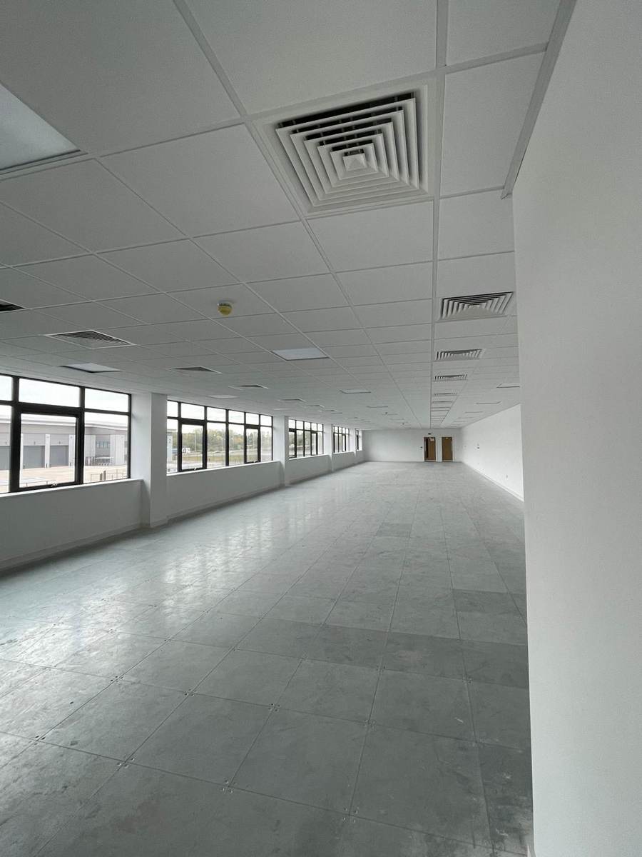 Completed office floor with suspended ceiling, diffusers and raised floor